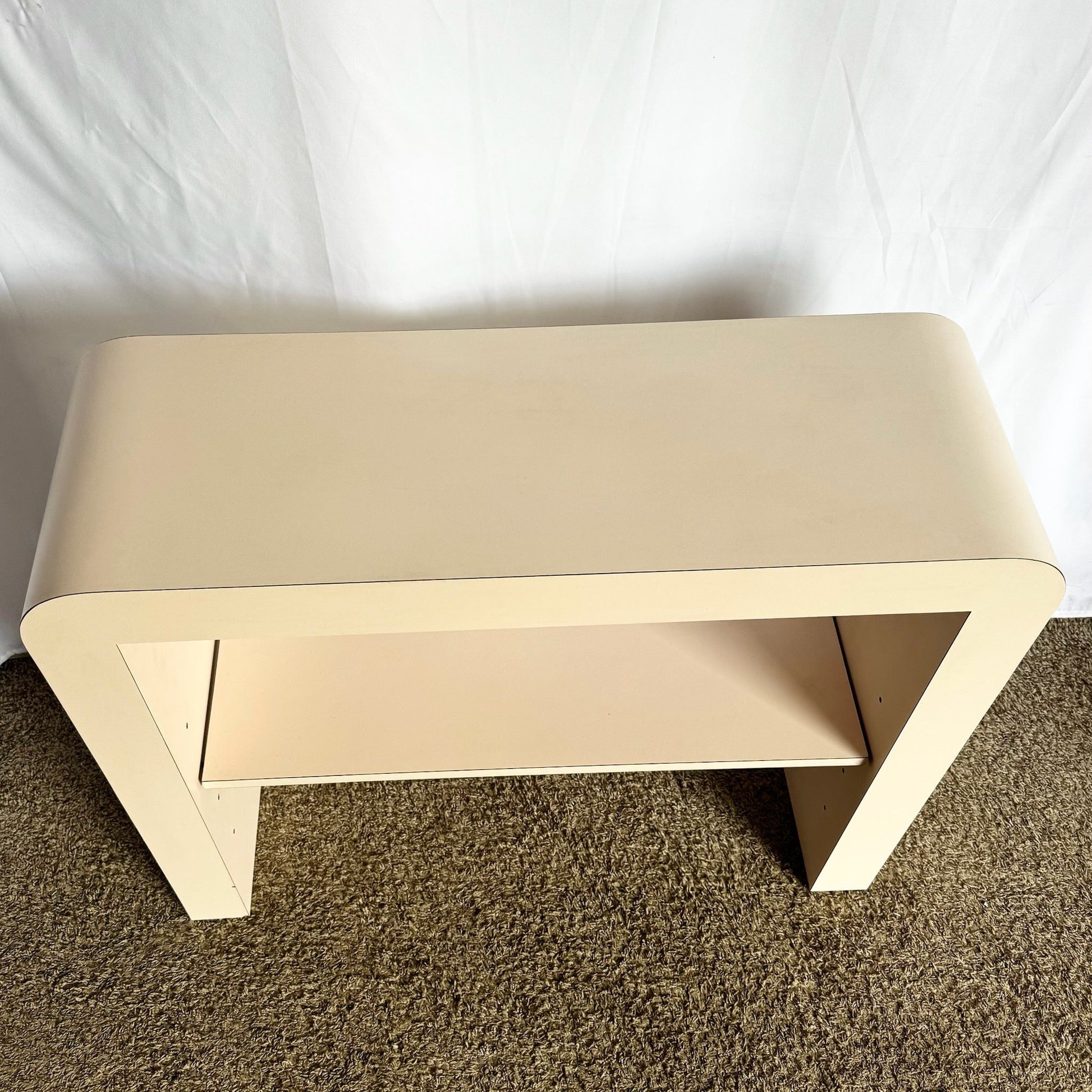Postmodern Light Pink Laminate Waterfall Console With Adjustable Shelf - Dolphin & Flamingo