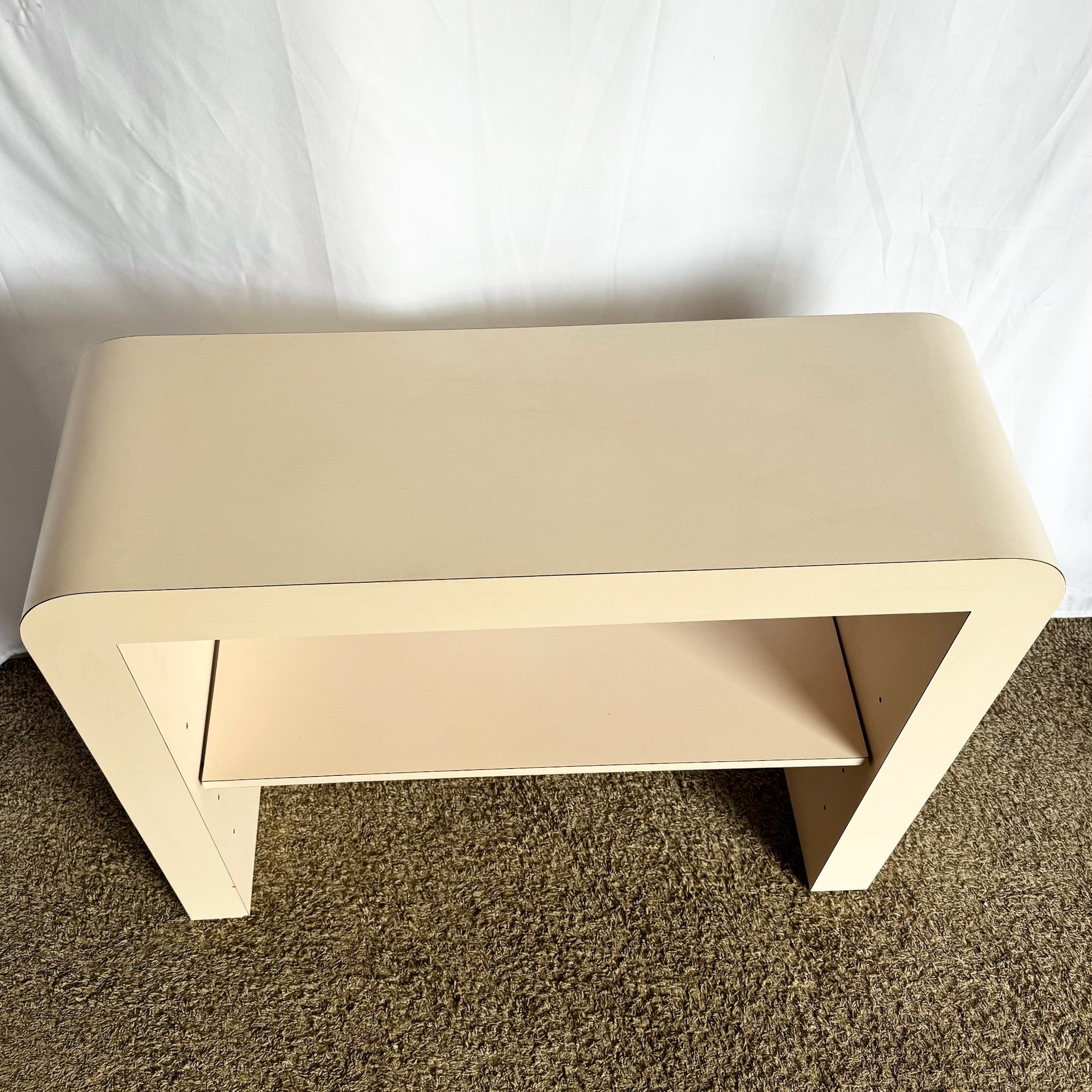 Postmodern Light Pink Laminate Waterfall Console With Adjustable Shelf - Dolphin & Flamingo