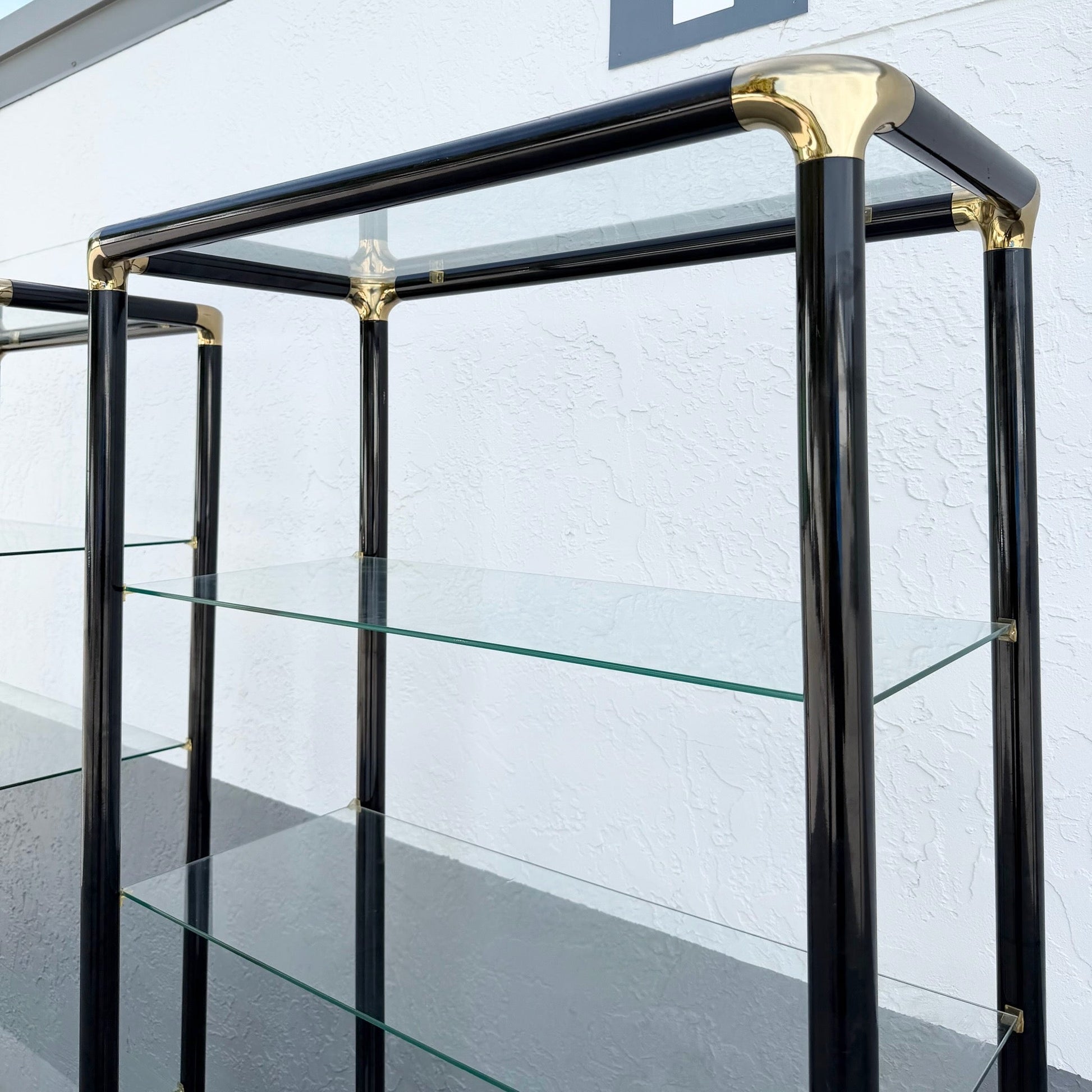 Art Deco Black Lacquered Etagere With Gold Accents and Glass Shelves - A Pair Dolphin & Flamingo