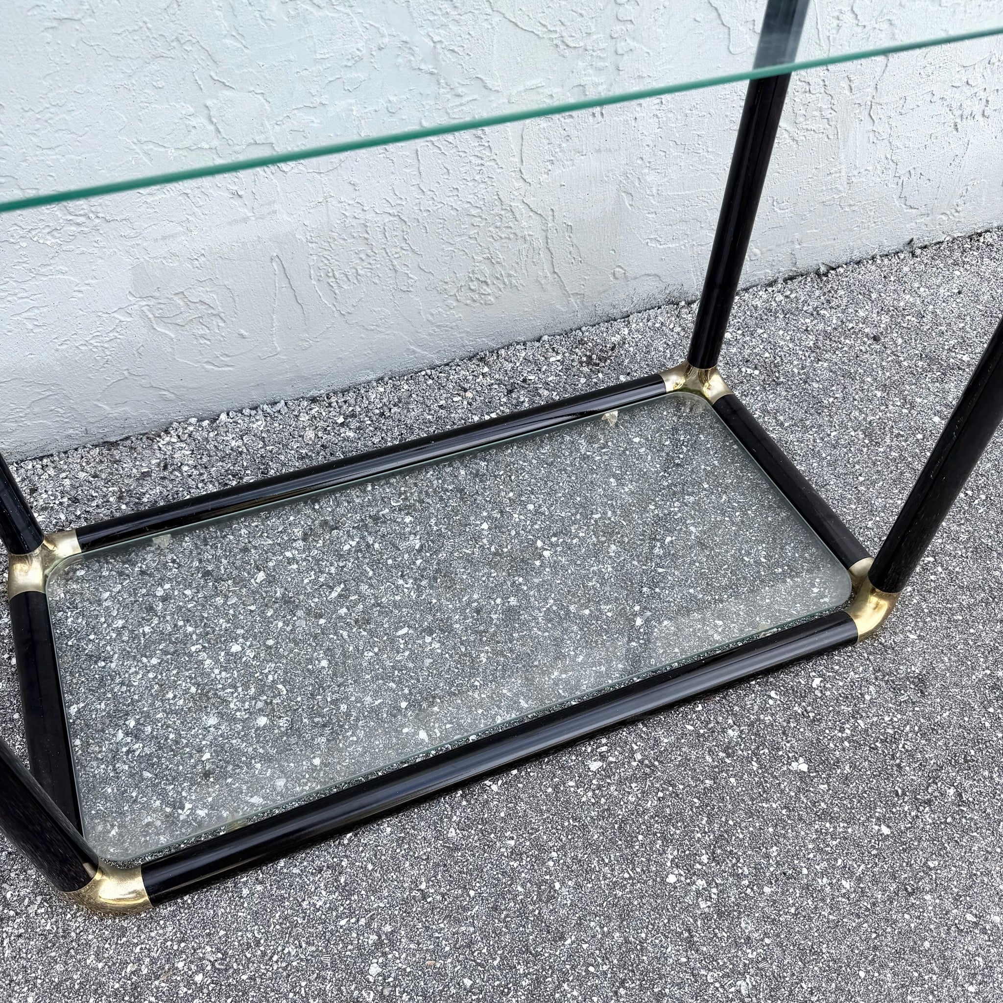 Art Deco Black Lacquered Etagere With Gold Accents and Glass Shelves - A Pair Dolphin & Flamingo