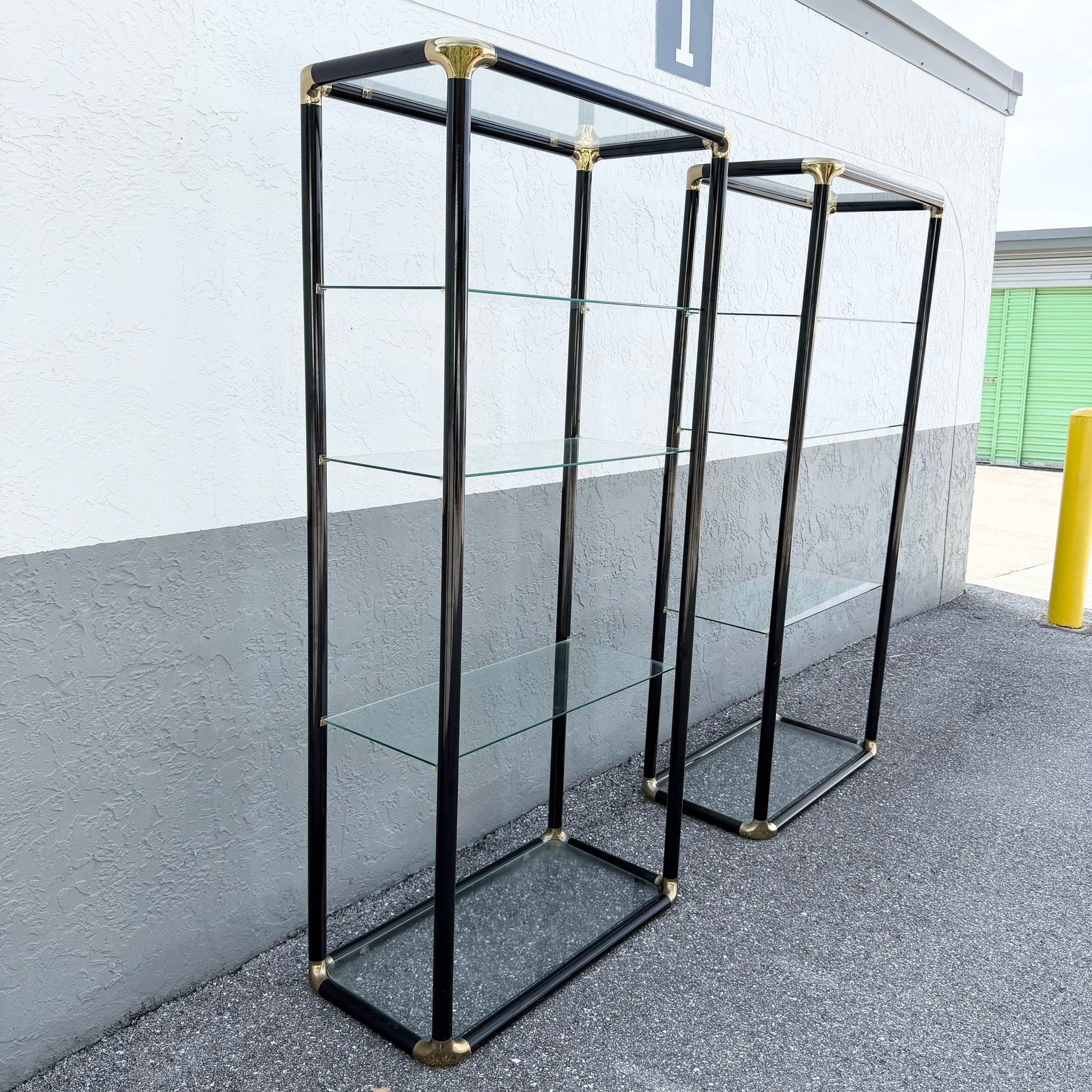 Art Deco Black Lacquered Etagere With Gold Accents and Glass Shelves - A Pair Dolphin & Flamingo