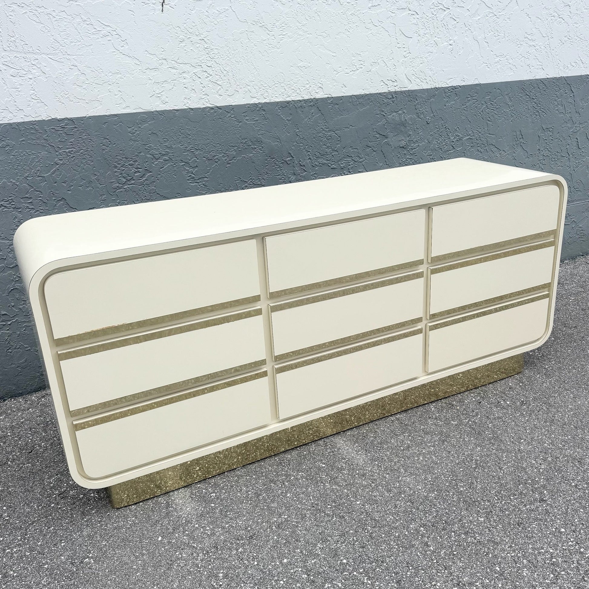 Postmodern Cream Gloss Laminate Waterfall Dresser With Gold Accents Dolphin & Flamingo