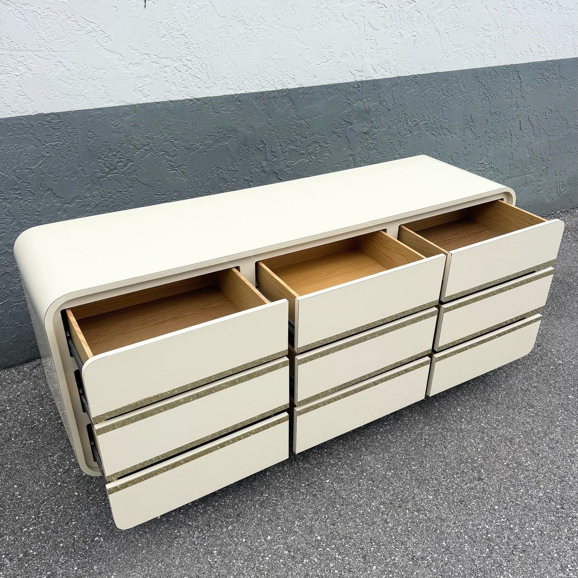 Postmodern Cream Gloss Laminate Waterfall Dresser With Gold Accents Dolphin & Flamingo
