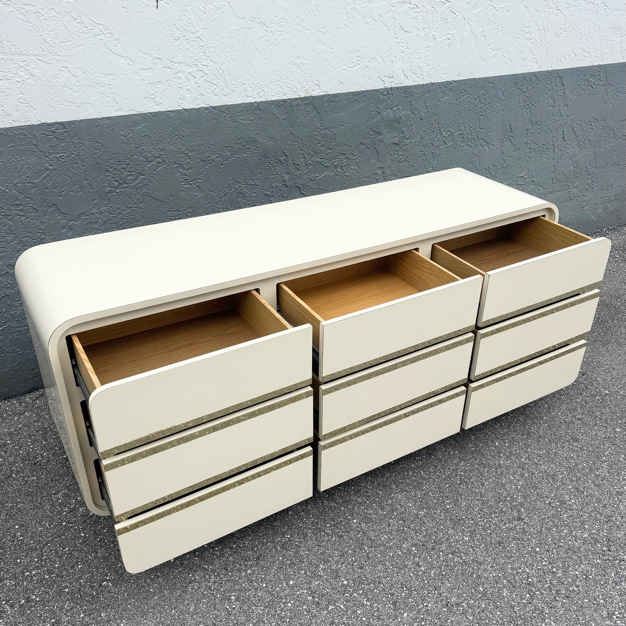 Postmodern Cream Gloss Laminate Waterfall Dresser With Gold Accents Dolphin & Flamingo