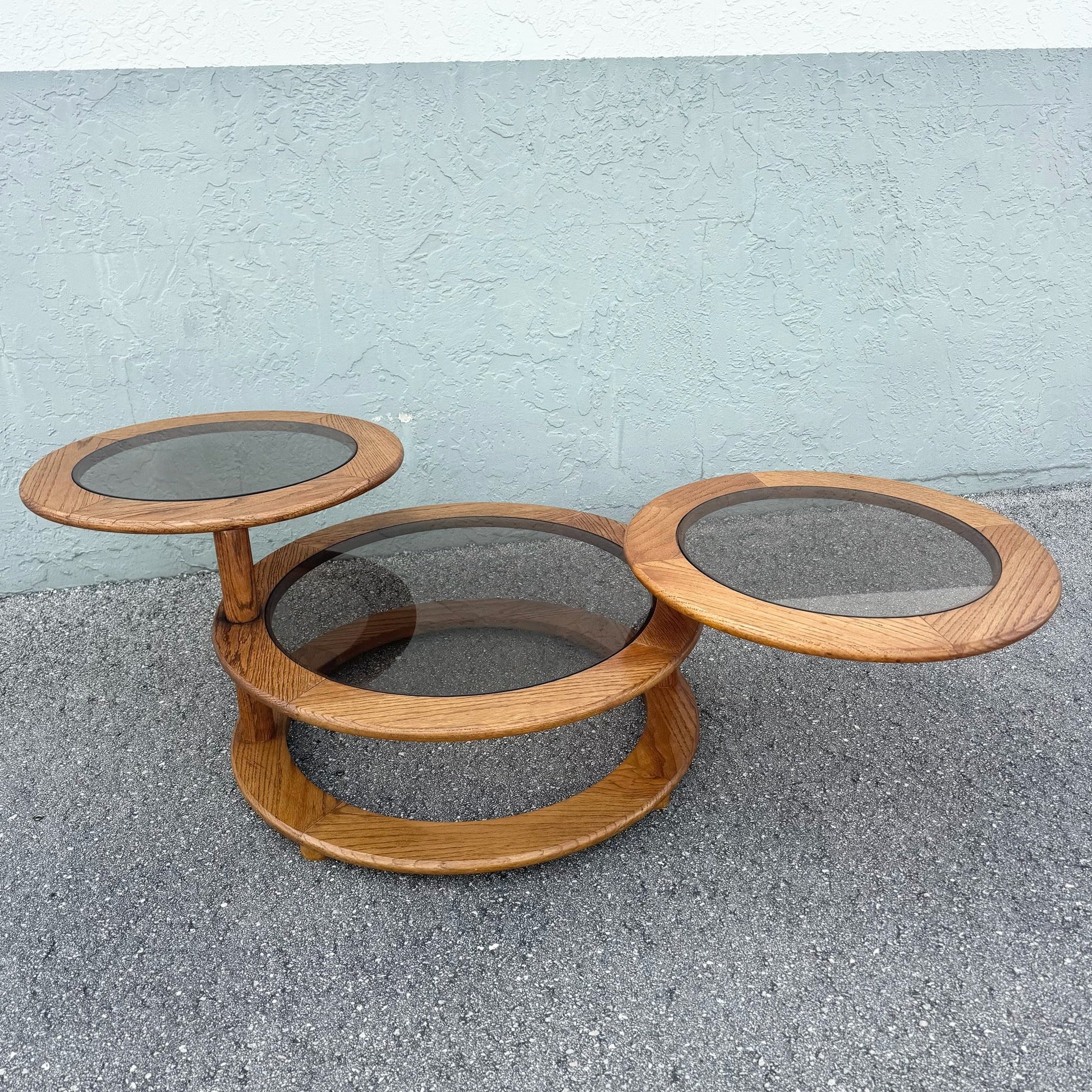 Mid Century Modern Three Tier Oak and Smoked Glass Swivel Coffee Table Dolphin & Flamingo