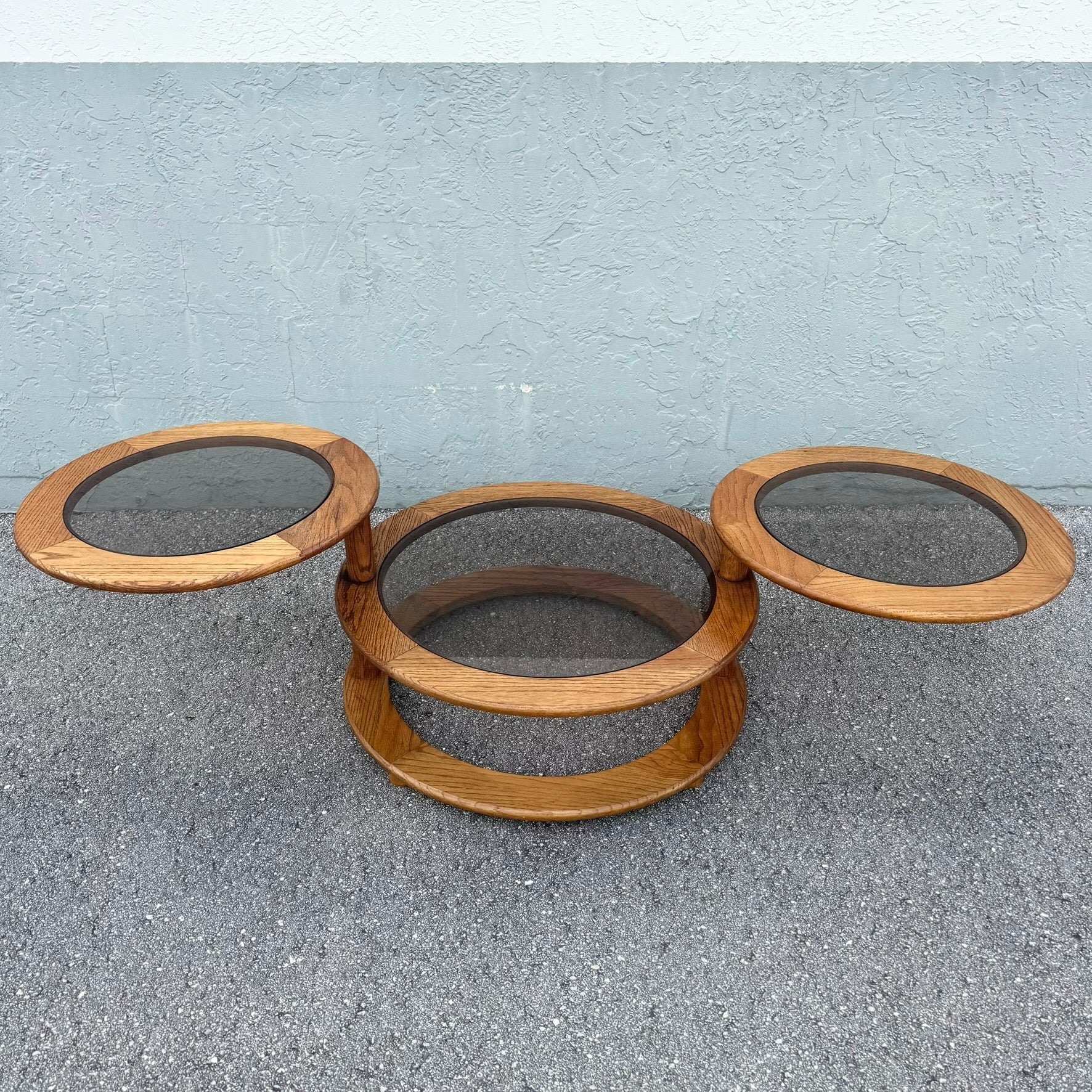 Mid Century Modern Three Tier Oak and Smoked Glass Swivel Coffee Table Dolphin & Flamingo