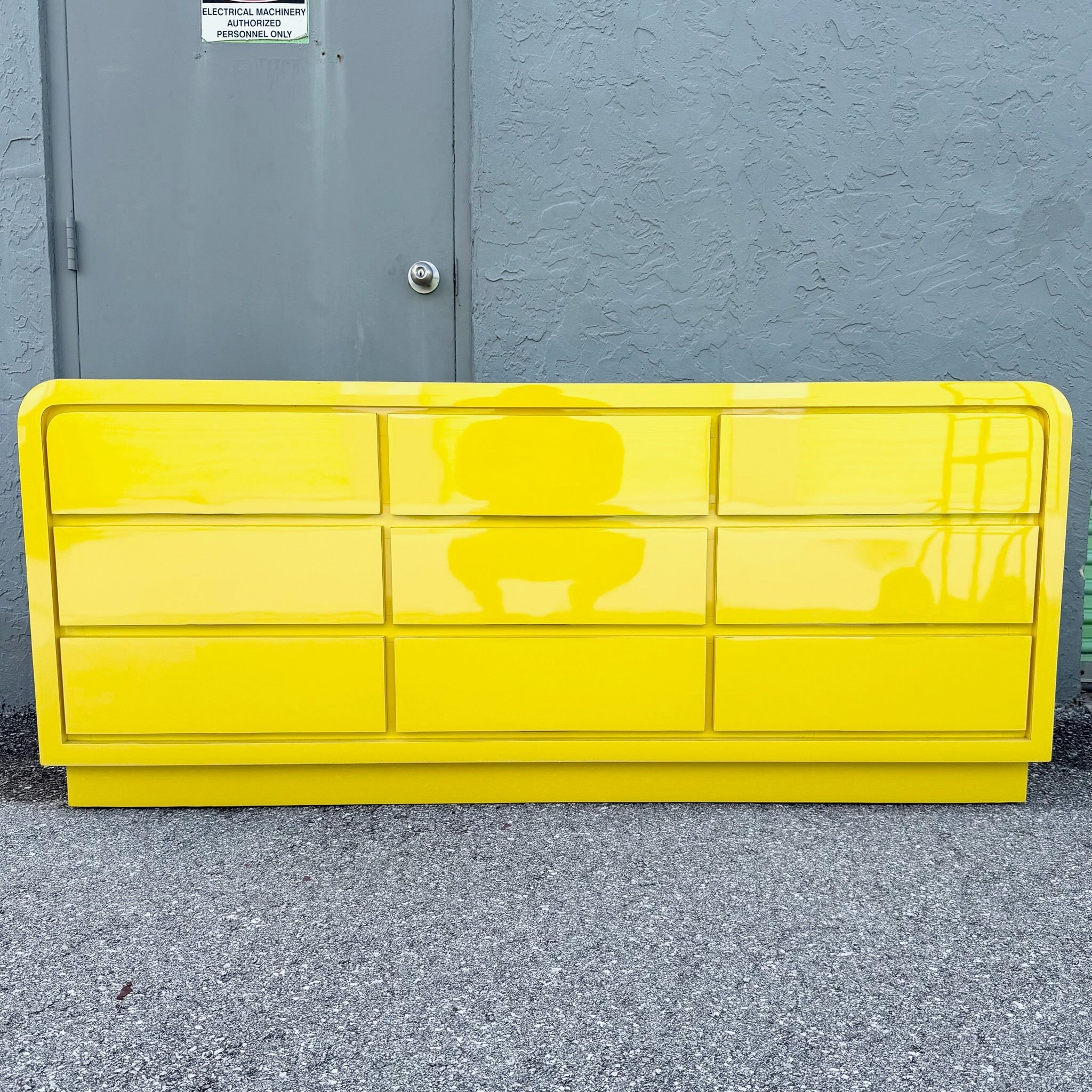 Postmodern Yellow Gloss Laminate Waterfall Dresser - 9 Drawers Dolphin & Flamingo
