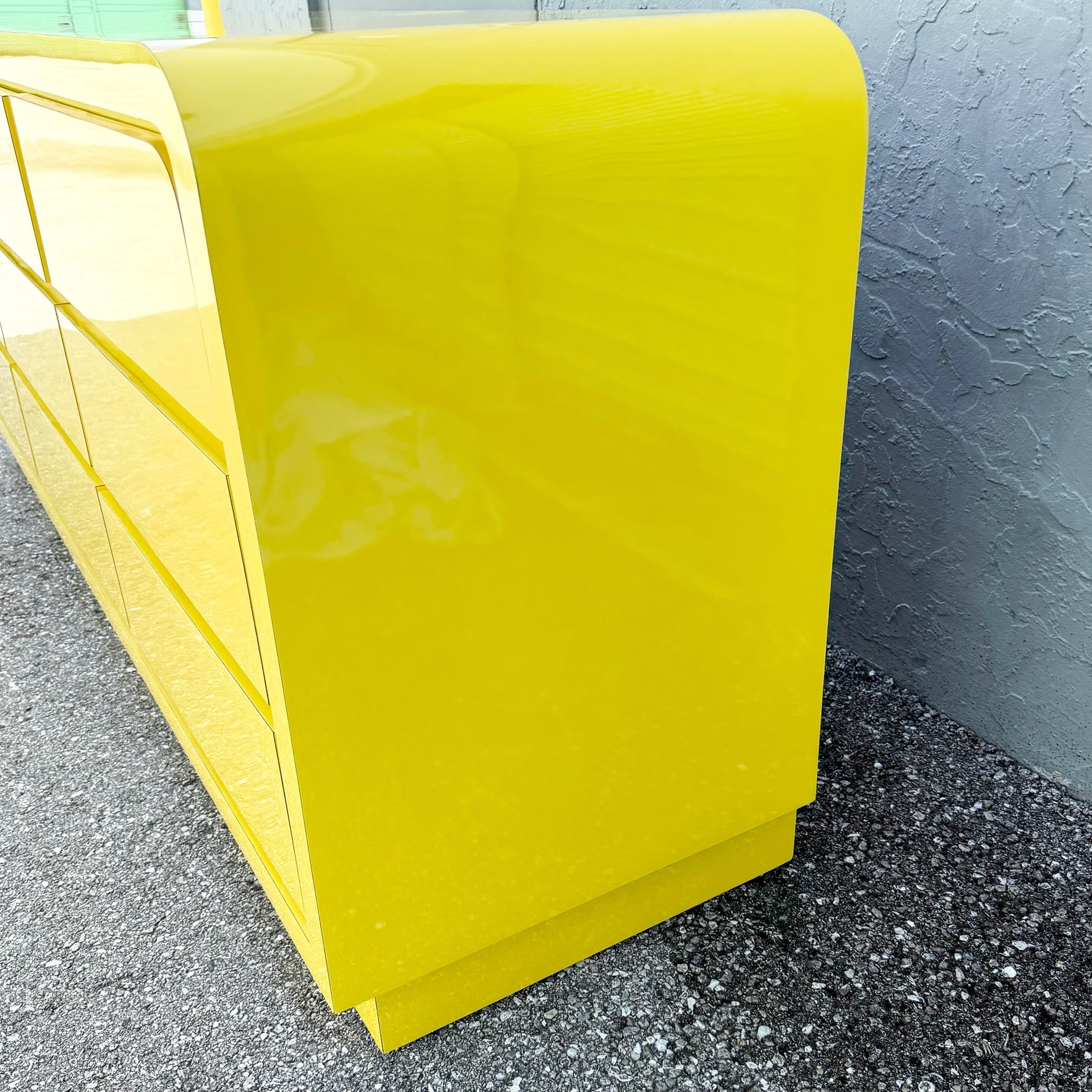 Postmodern Yellow Gloss Laminate Waterfall Dresser - 9 Drawers Dolphin & Flamingo