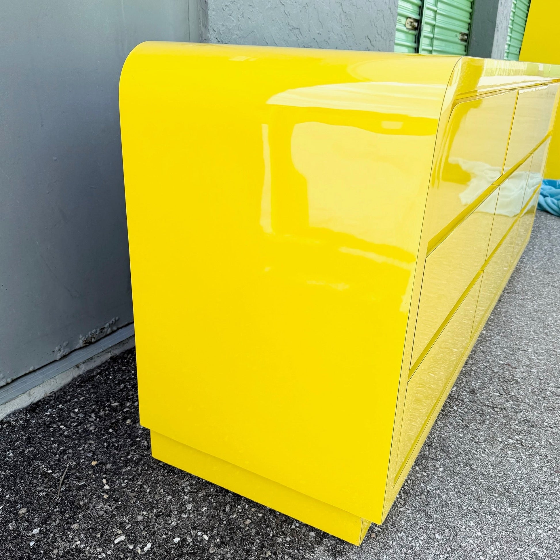 Postmodern Yellow Gloss Laminate Waterfall Dresser - 9 Drawers Dolphin & Flamingo