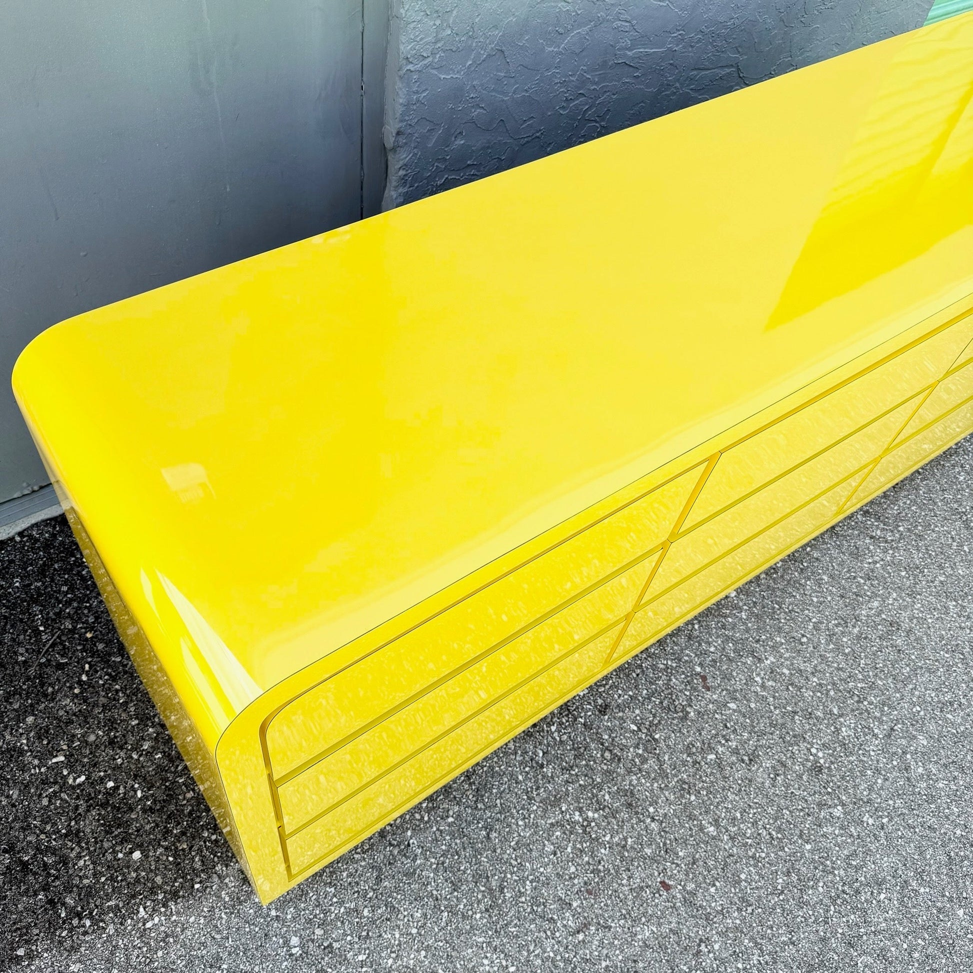 Postmodern Yellow Gloss Laminate Waterfall Dresser - 9 Drawers Dolphin & Flamingo