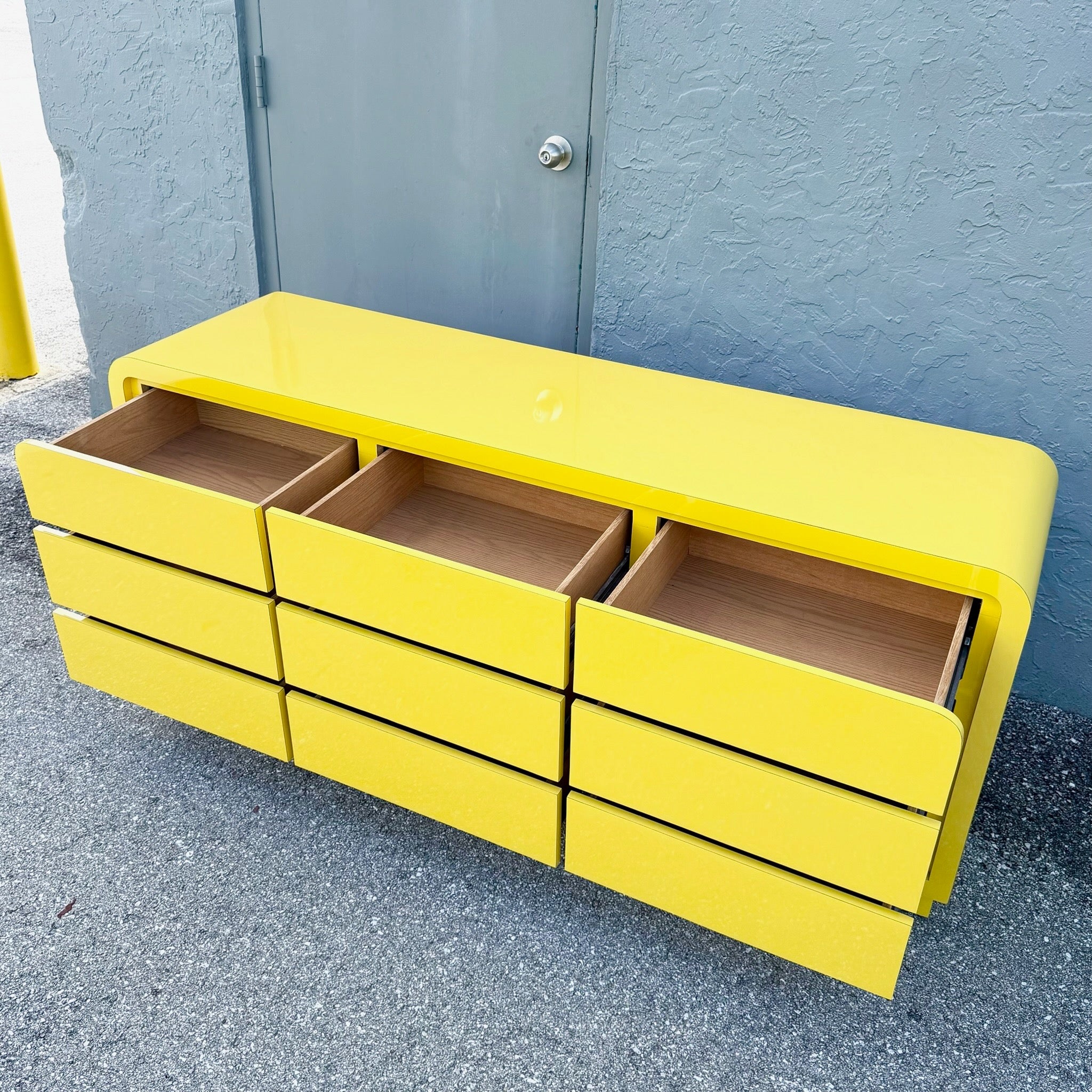 Postmodern Yellow Gloss Laminate Waterfall Dresser - 9 Drawers Dolphin & Flamingo