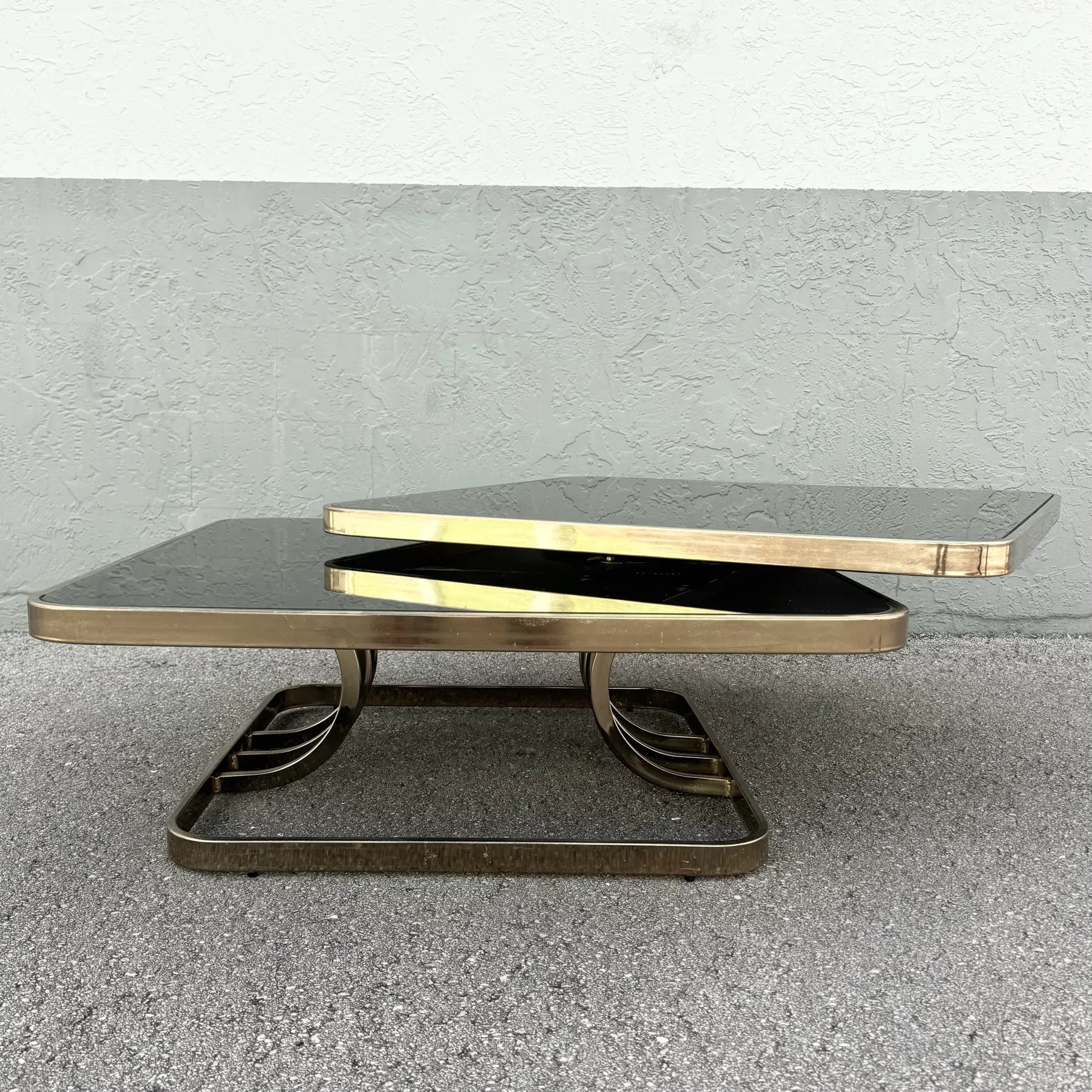 Art Deco Gold and Black Glass Swivel Top Two Tier Coffee Table Dolphin & Flamingo