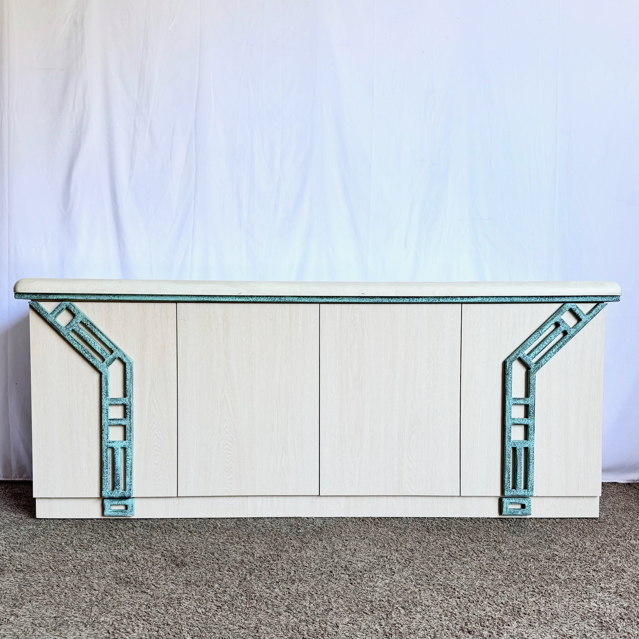 Postmodern Beige Wood Grain Laminate Credenza With Tribal Turquoise Metal Accents - Dolphin & Flamingo