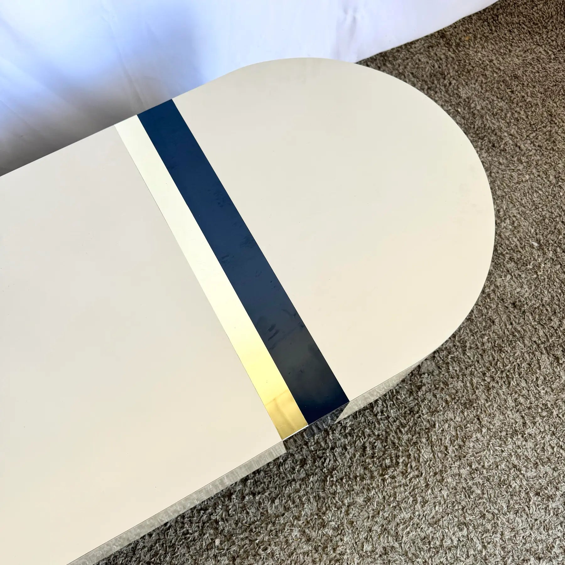 Postmodern Cream Laminate Love Stick Coffee Table With Navy Blue and Gold Crown Accent on Casters - Dolphin & Flamingo