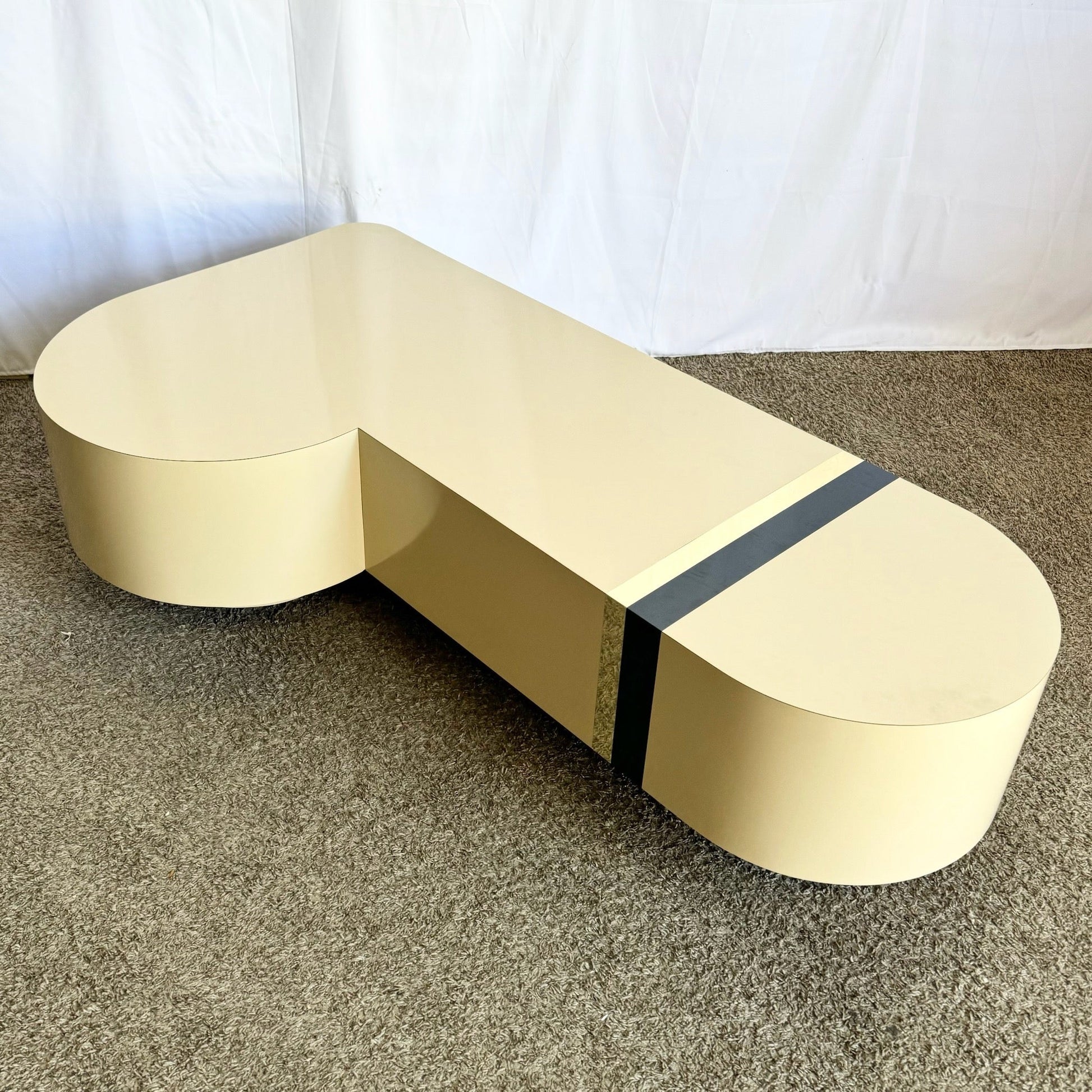Postmodern Cream Laminate Love Stick Coffee Table With Navy Blue and Gold Crown Accent on Casters - Dolphin & Flamingo
