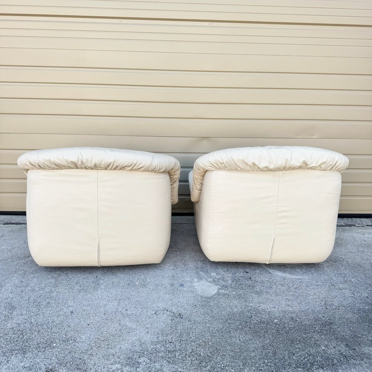 Postmodern Cream Sculpted Tufted Leather Swivel Lounge Chairs - A Pair - Dolphin & Flamingo