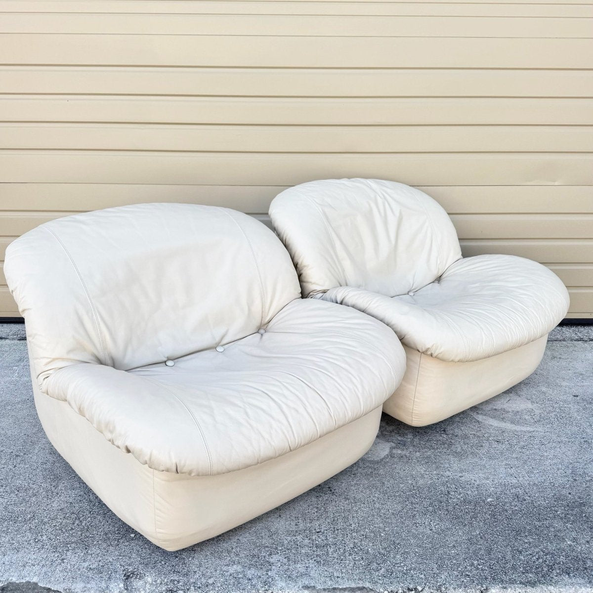 Postmodern Cream Sculpted Tufted Leather Swivel Lounge Chairs - A Pair - Dolphin & Flamingo