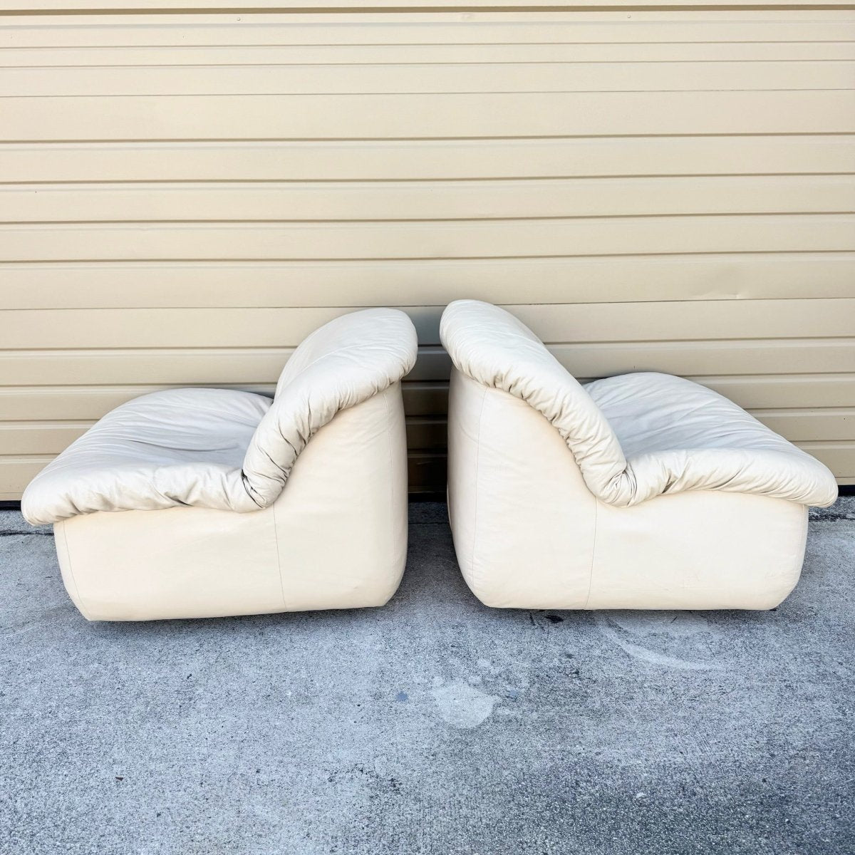 Postmodern Cream Sculpted Tufted Leather Swivel Lounge Chairs - A Pair - Dolphin & Flamingo