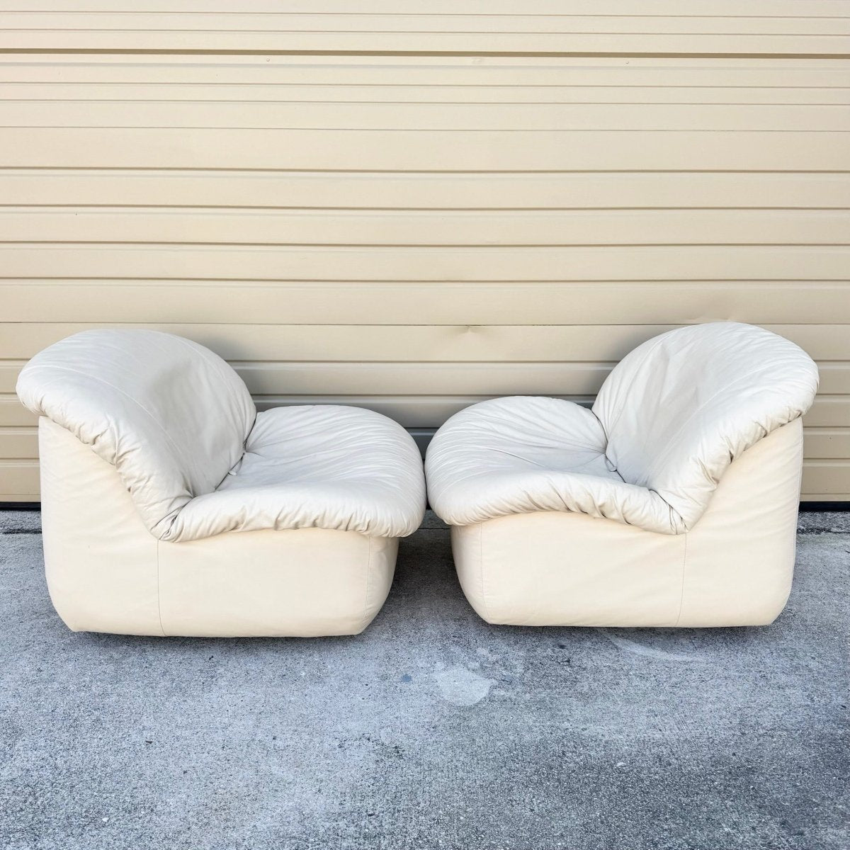 Postmodern Cream Sculpted Tufted Leather Swivel Lounge Chairs - A Pair - Dolphin & Flamingo
