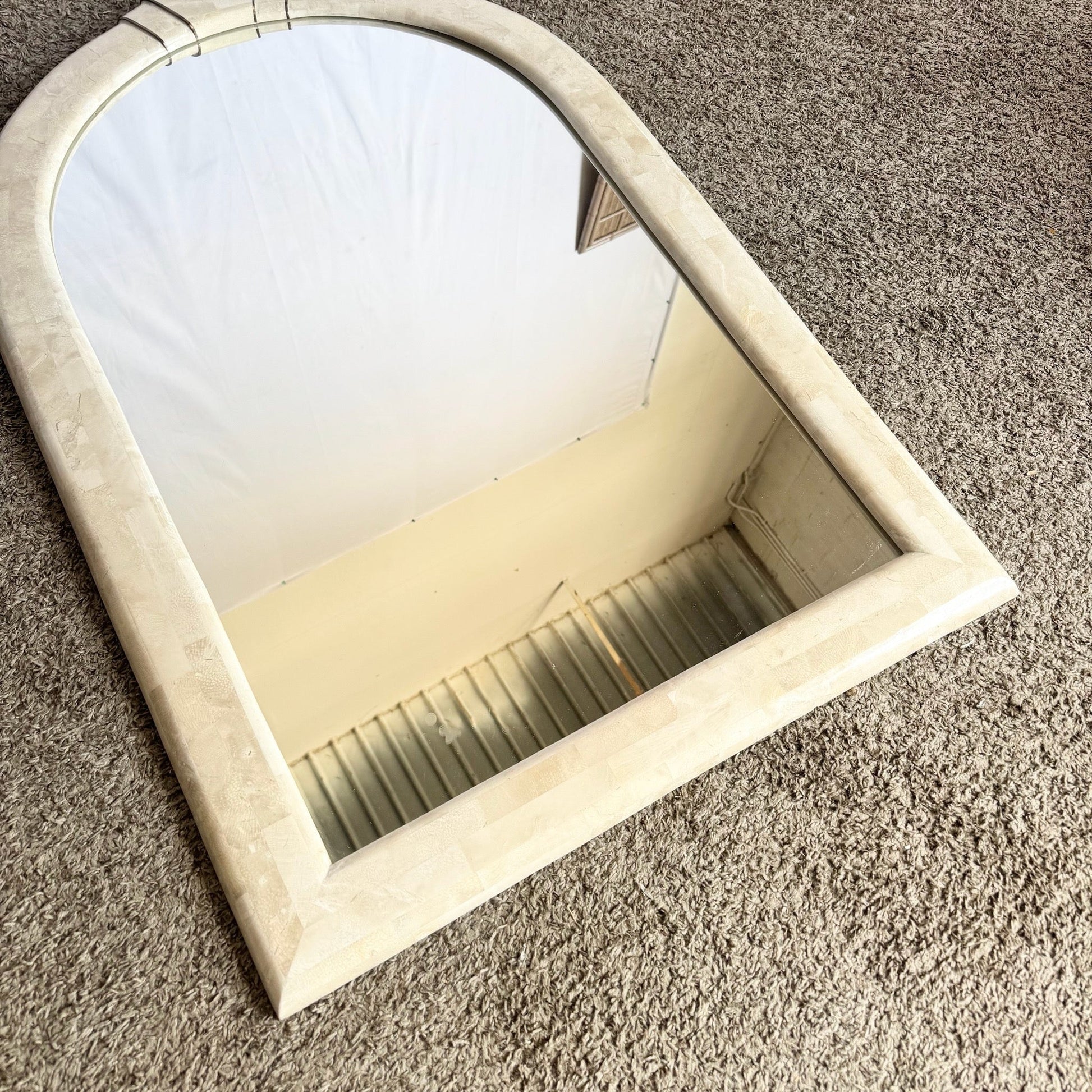 Postmodern Polished Tessellated Stone Wall Mirror With Brass Inlay by Alexvale Furniture - Dolphin & Flamingo