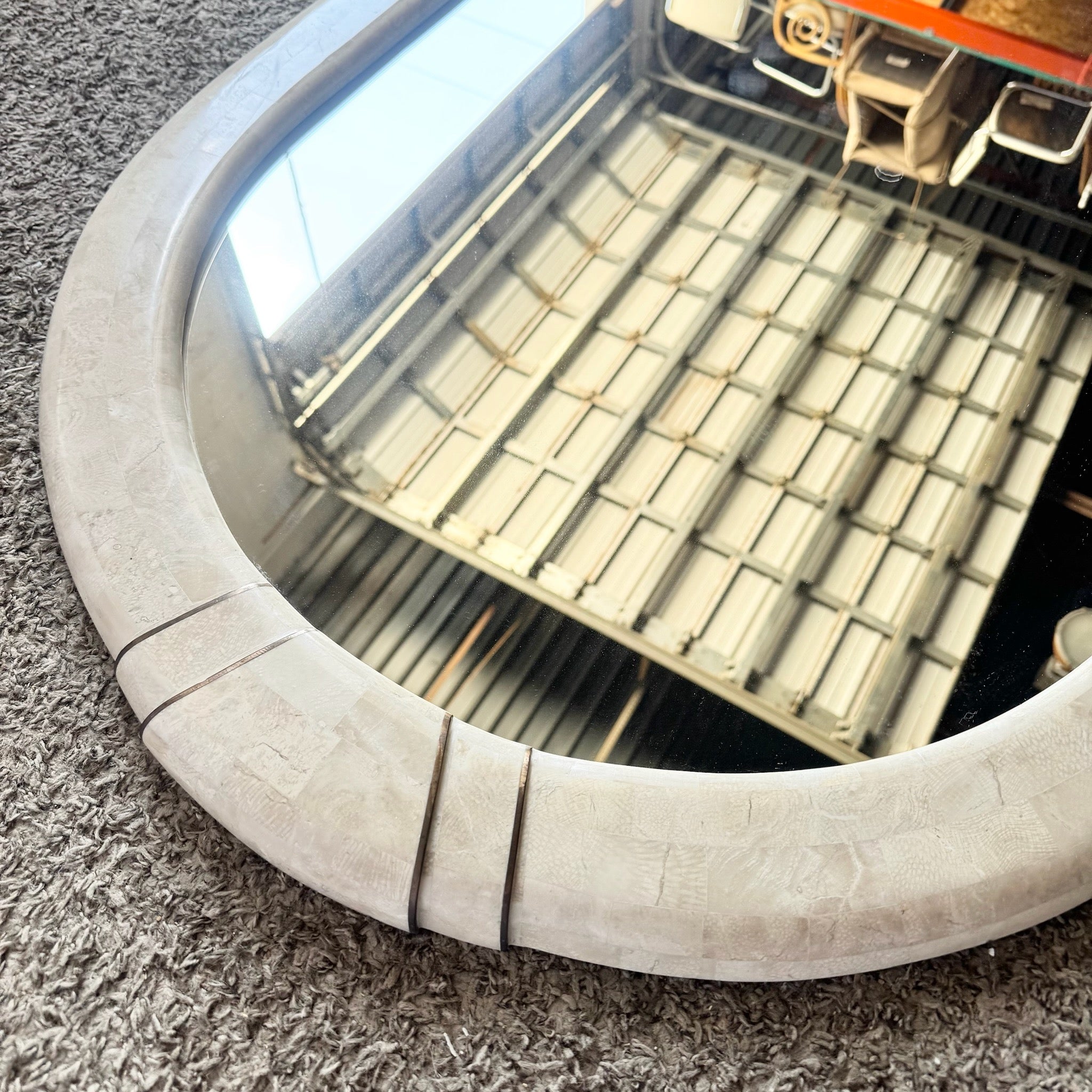 Postmodern Polished Tessellated Stone Wall Mirror With Brass Inlay by Alexvale Furniture - Dolphin & Flamingo
