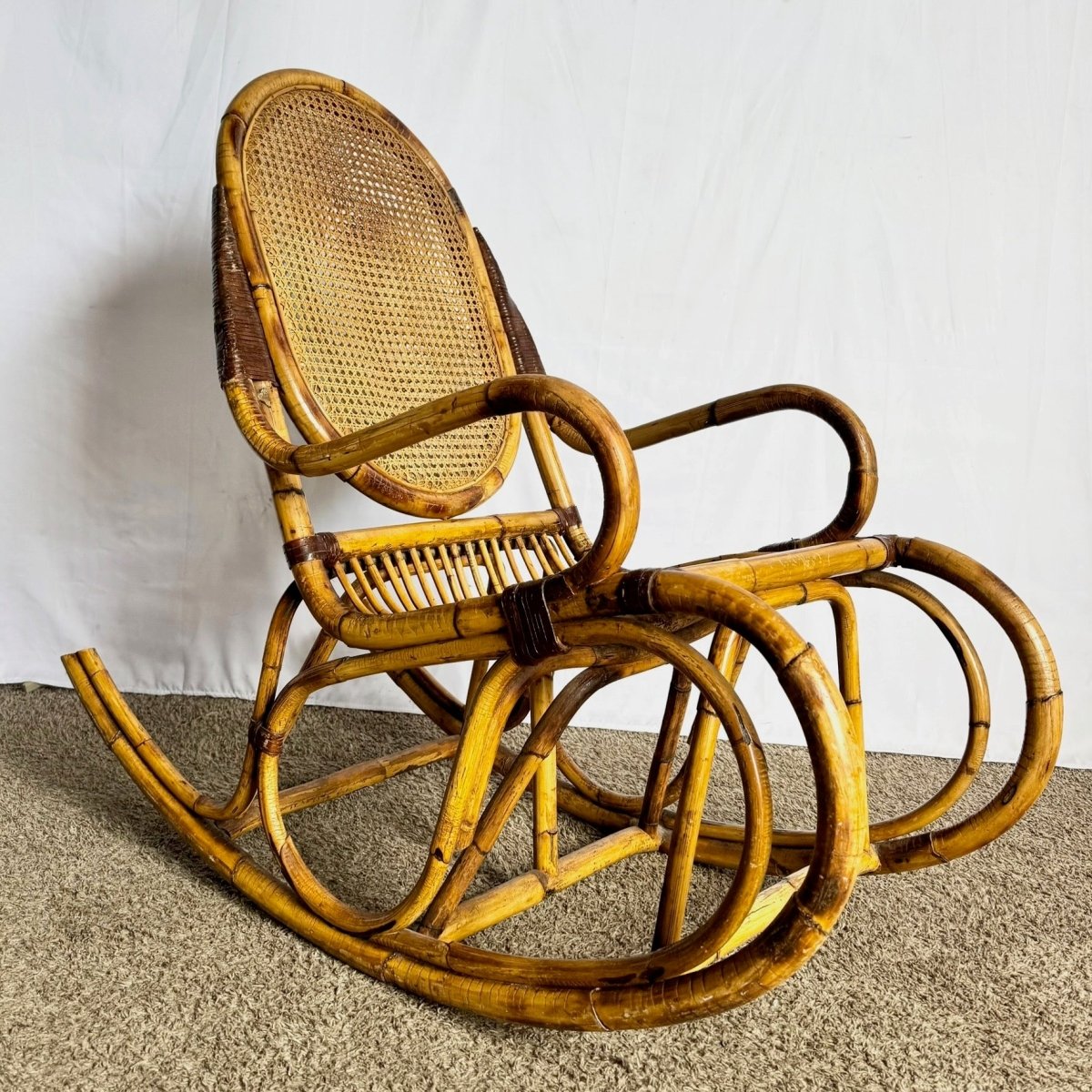 Vintage Boho Chic Bamboo and Cane Rocking Chair - Dolphin & Flamingo