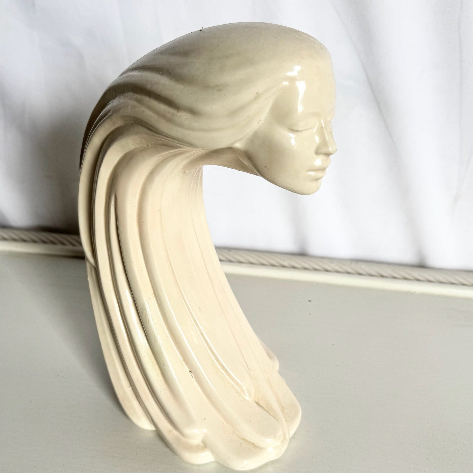 “Woman of the Wind" or "Moderne Frauenbüste Mit Langem Haar Aus Steinguss” From Ceramic - Dolphin & Flamingo